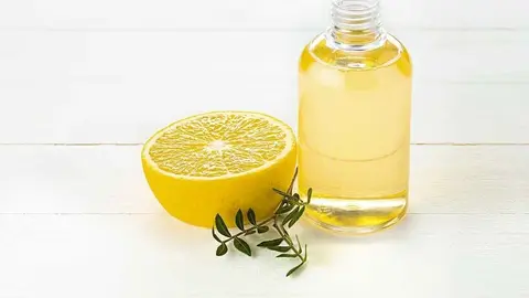 The oranges oil from orange on green studio background